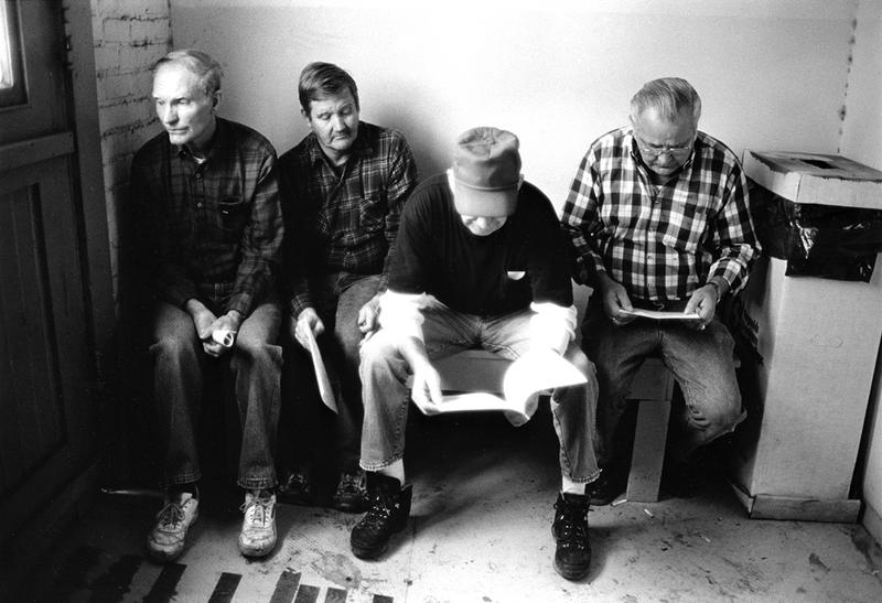 Workers with their pension papers